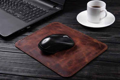 Genuine leather mouse pad placed on desk with mouse