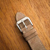 Close-up view of suede leather watch strap showcasing premium quality and texture.